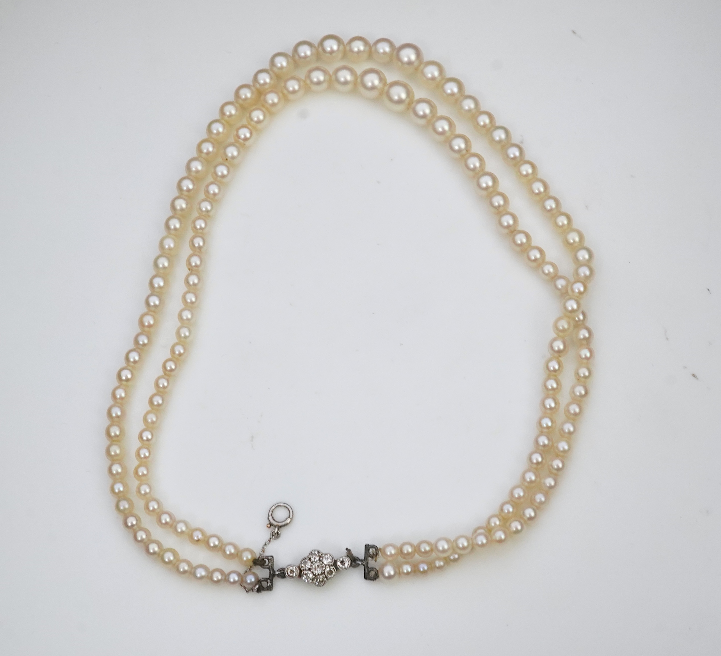 A cultured pearl and diamond necklace, early 20th century and later